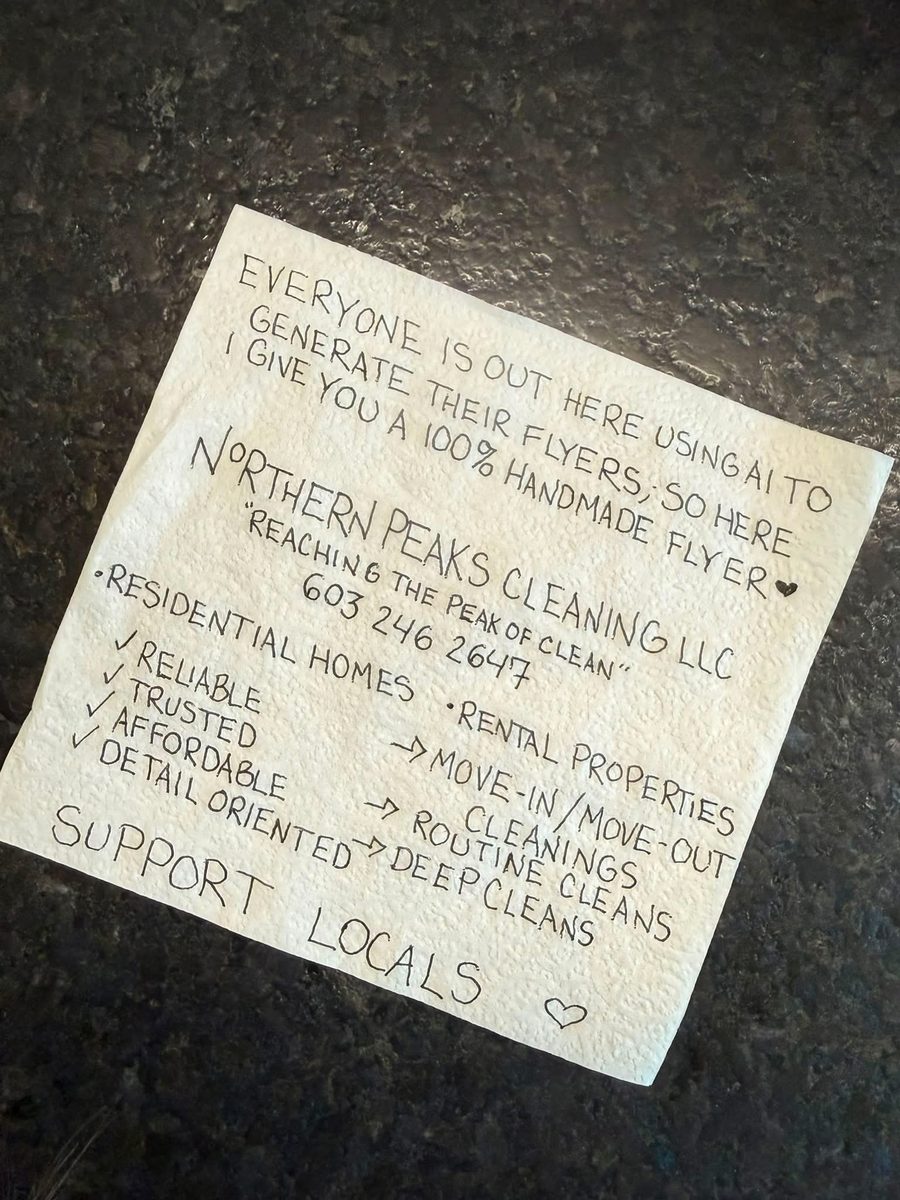 Tinora's handwritten flyer on a paper towel: Northern Peaks Cleaning LLC, Reaching the peak of clean, 603 246 2647, residential homes and rental properties, reliable, trusted, affordable, detail oriented, support locals