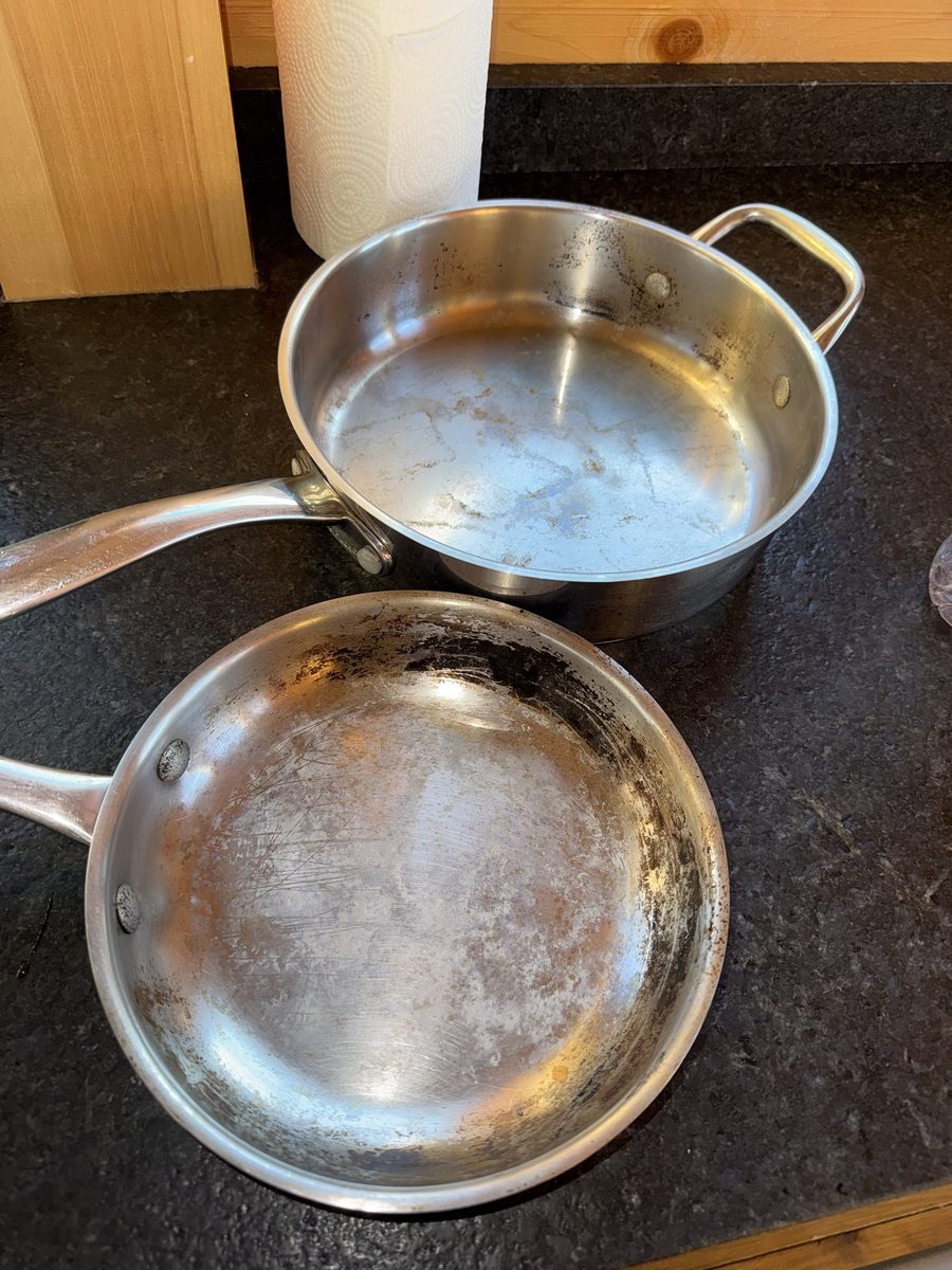 Before: two stainless steel pans with burnt-on stains and cloudy residue